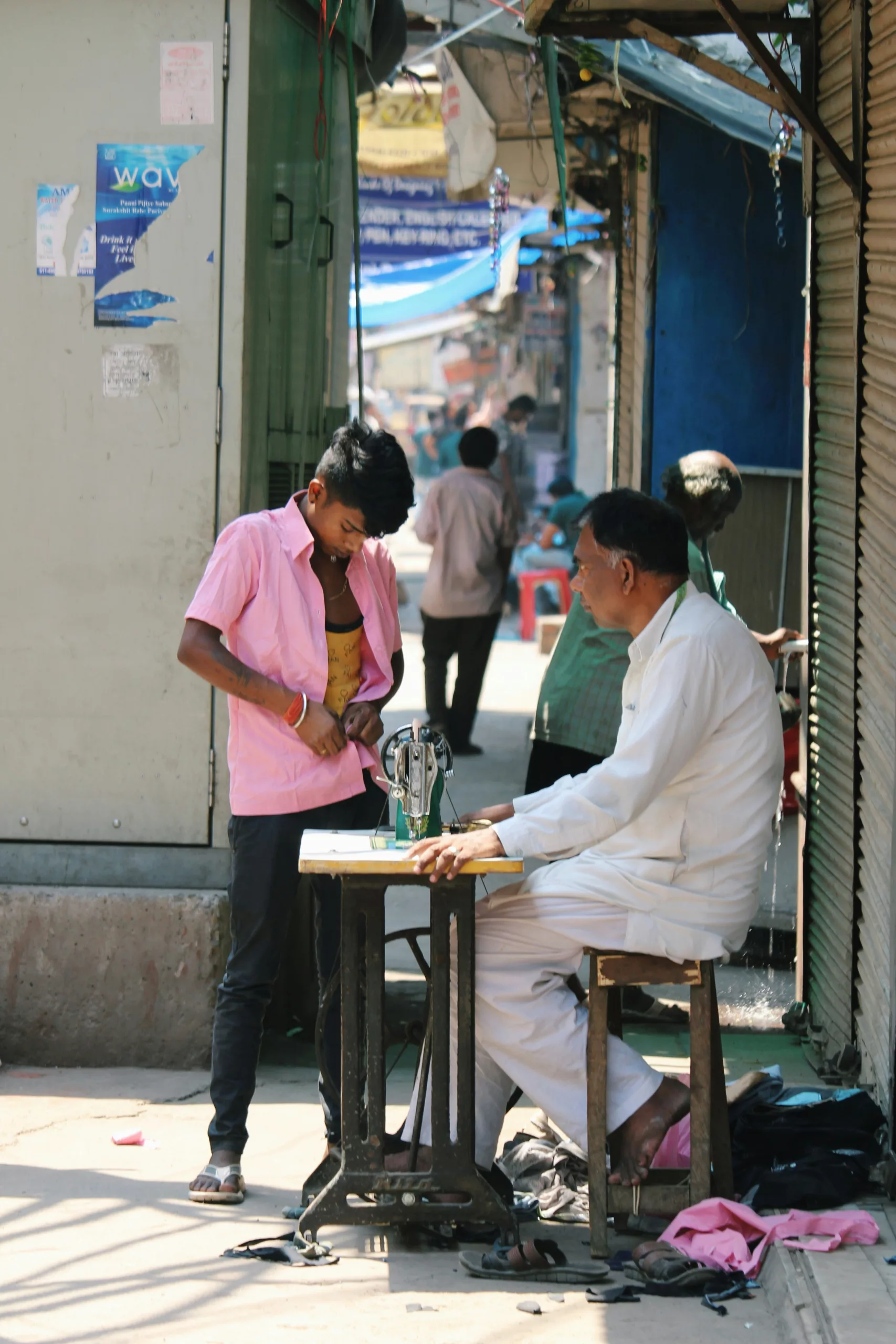 Relaxed owner drinking coffee while looking at revenue charts on mobile phone