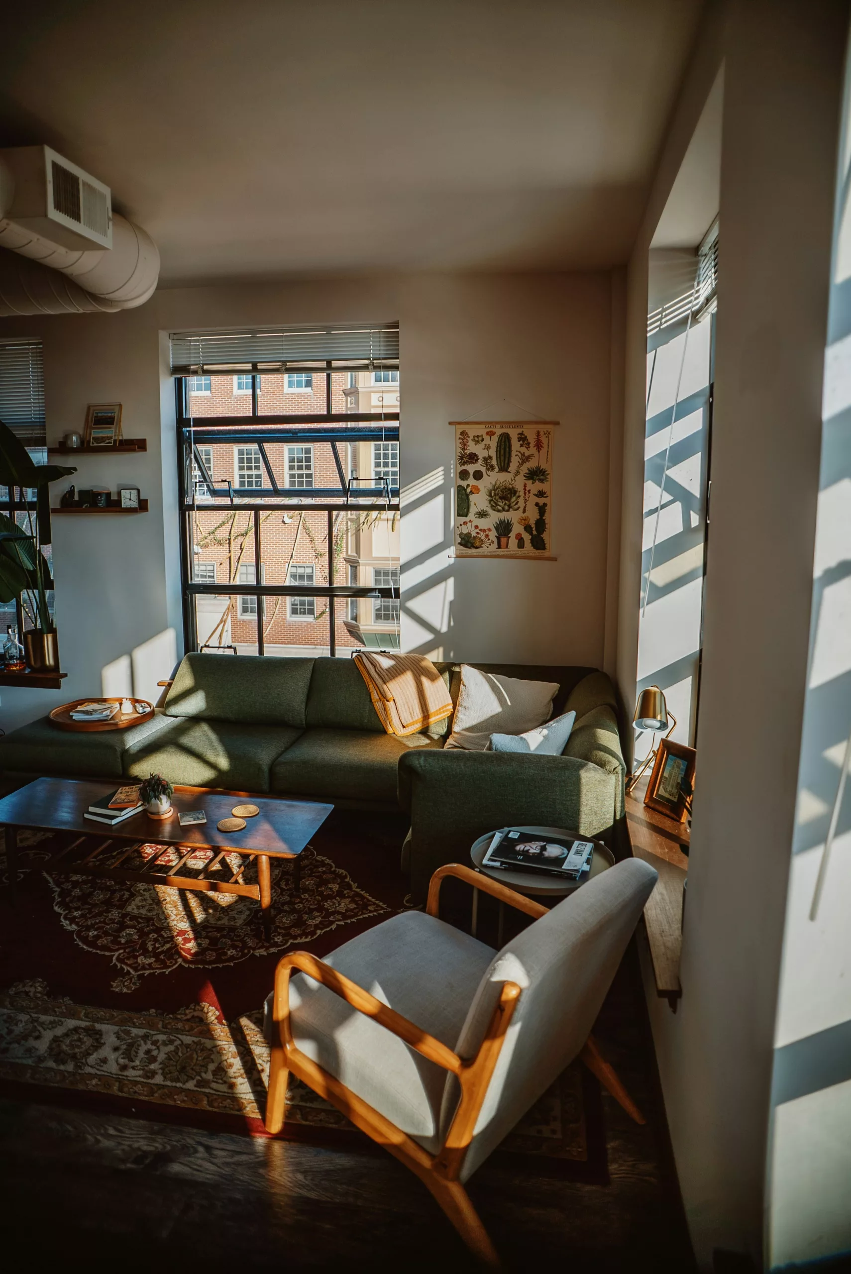 Professional photographer taking pictures of a well-decorated apartment for an Airbnb listing