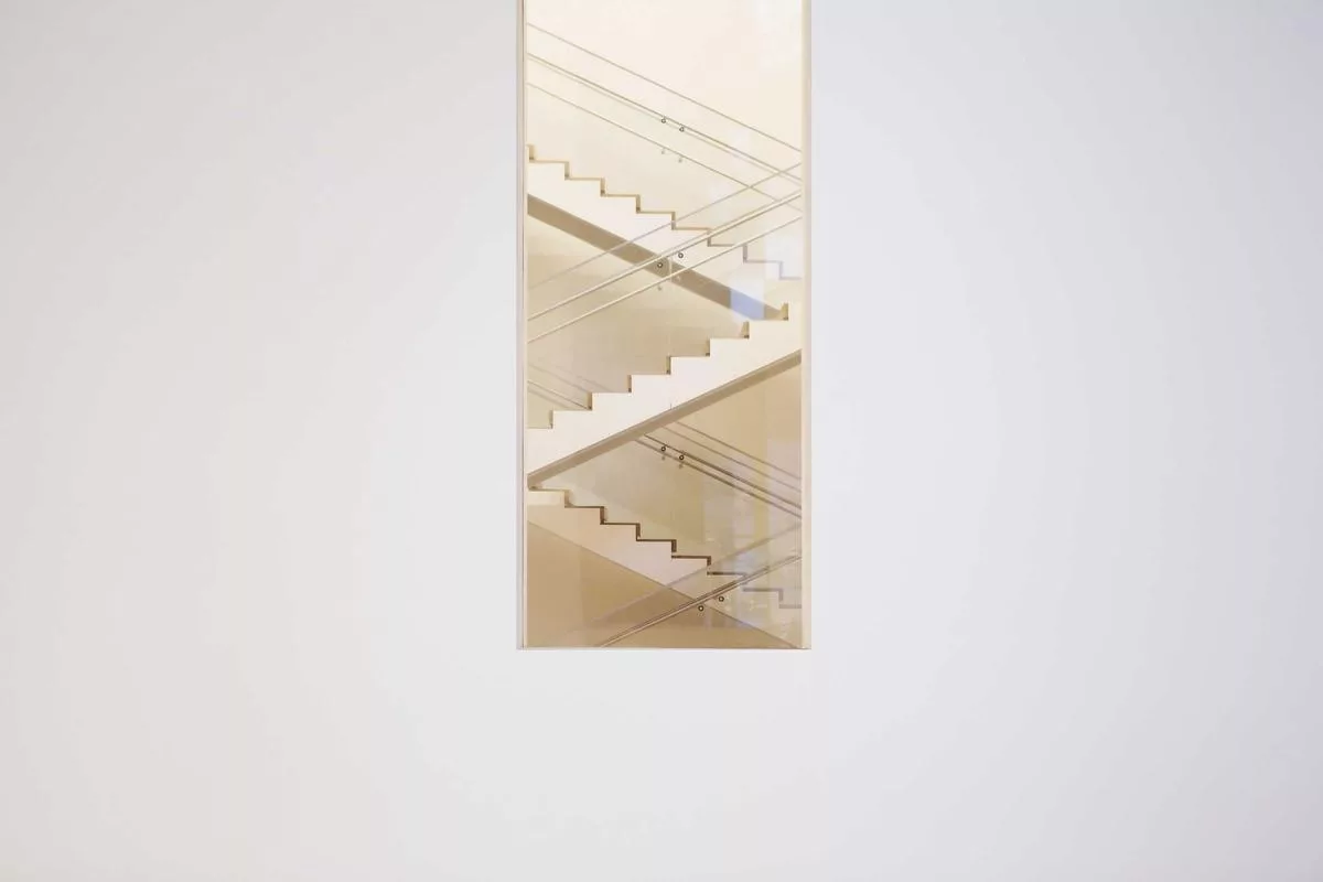 Minimalist staircase with clean lines and glass panels.