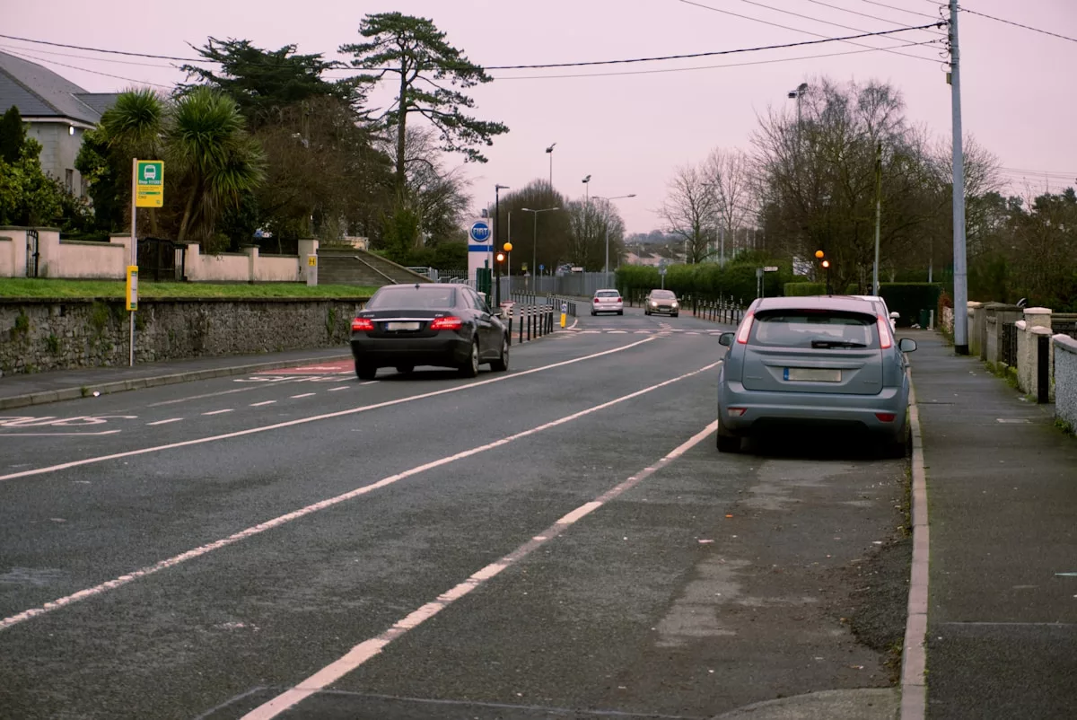 a couple of cars that are sitting in the street