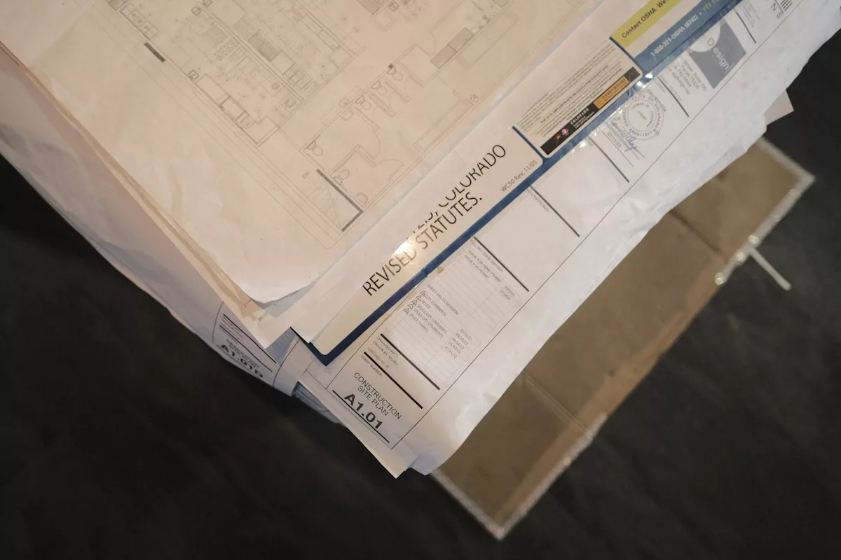 a stack of flyers on a table