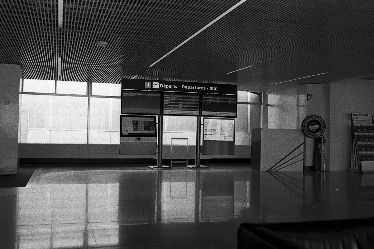 a black and white photo of a train station