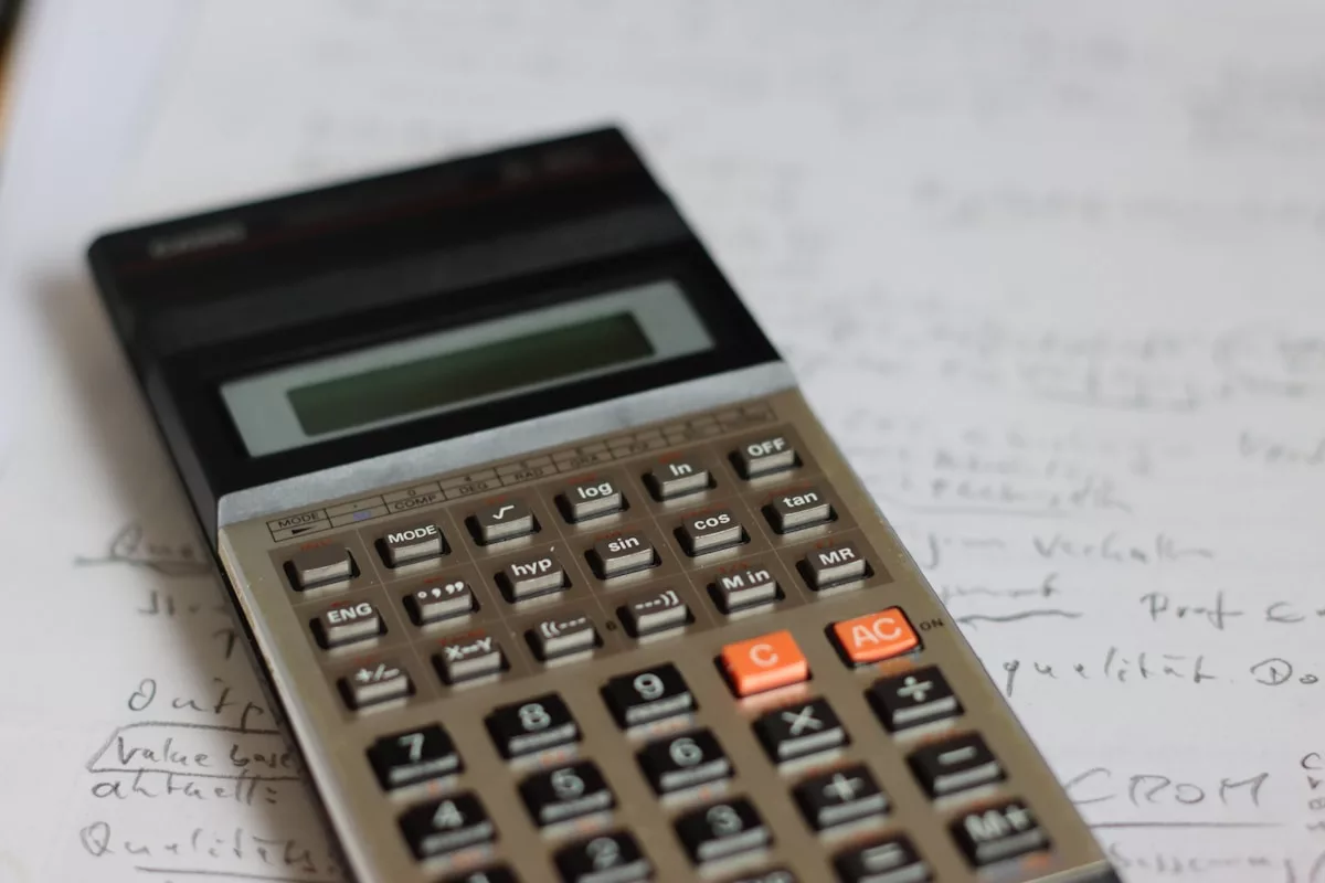 a calculator sitting on top of a piece of paper