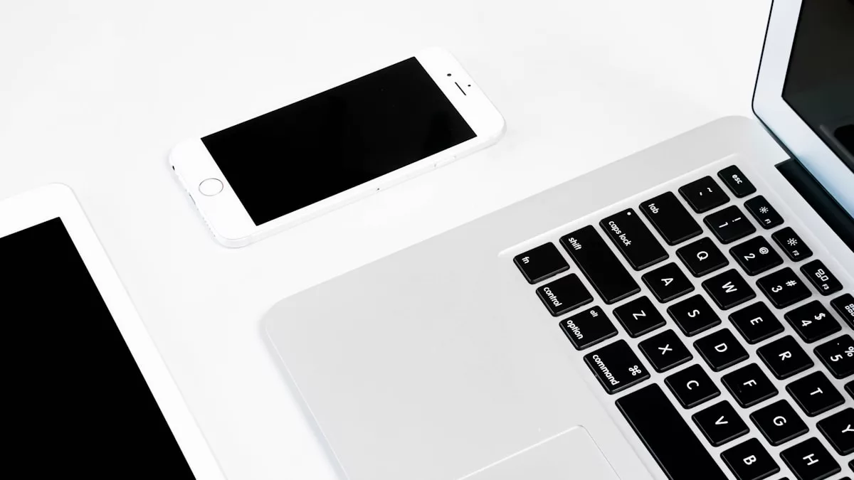 a white rectangular device with a black screen and a white keyboard